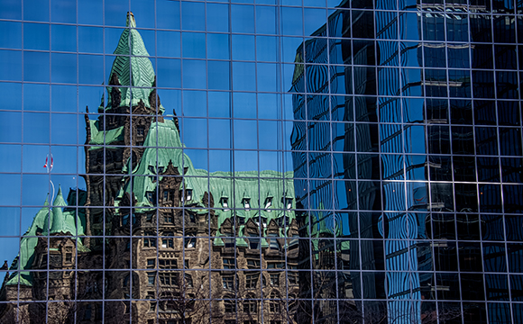 Parliament Hill reflected in downtown Ottawa office building